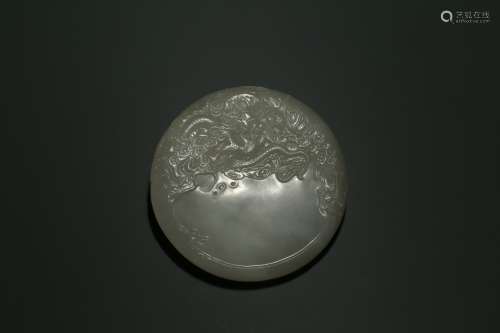 A CHINESE WHITE JADE 'DRAGON' WASHER