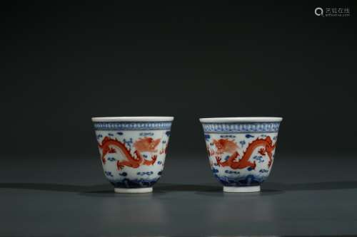 A PAIR OF CHINESE FAMILLE ROSE 'DRAGON' WINE CUPS