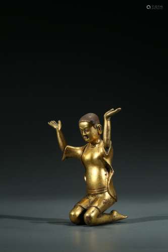 A CHINESE GILT BRONZE KNEELING FIGURE