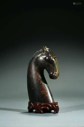 A CHINESE GREEN JADE HORSE HEAD