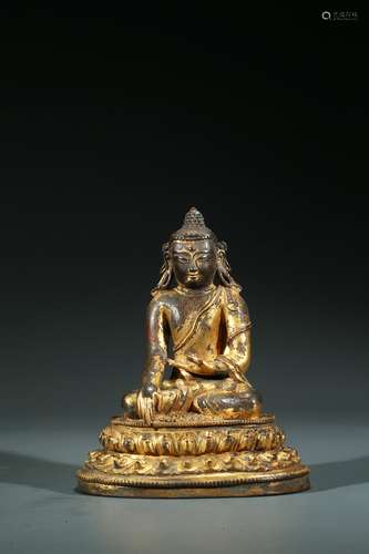 A TIBETAN GILT BRONZE FIGURE OF SHAKYAMUNI