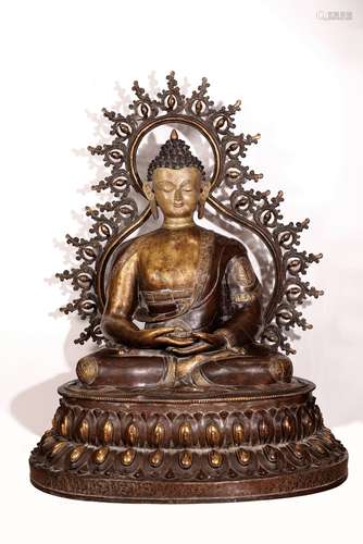 A LARGE TIBETAN PARCEL-GILT BRONZE FIGURE OF BUDDHA