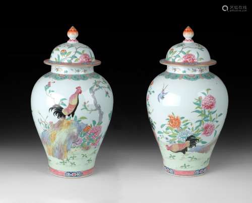 A CHINESE PAIR OF FAMILLE ROSE JARS WITH COVERS