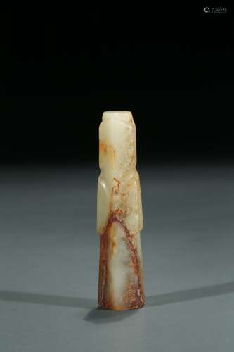 A CELADON AND RUSSET JADE FIGURE CARVING