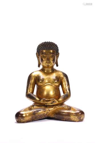 A GILT BRONZE FIGURE OF GURU