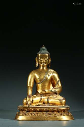 A TIBETAN GILT BRONZE FIGURE OF SHAKYAMUNI