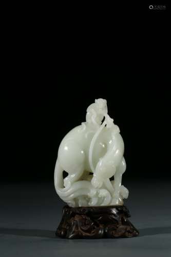 A WHITE JADE CARVING OF MONKEY AND HORSE