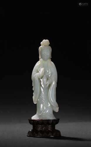 A WHITE JADE FIGURE OF STANDING GUANYIN