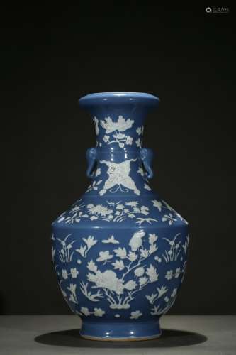 A BLUE AND WHITE RESERVE-DECORATED 'FLOWER' VASE
