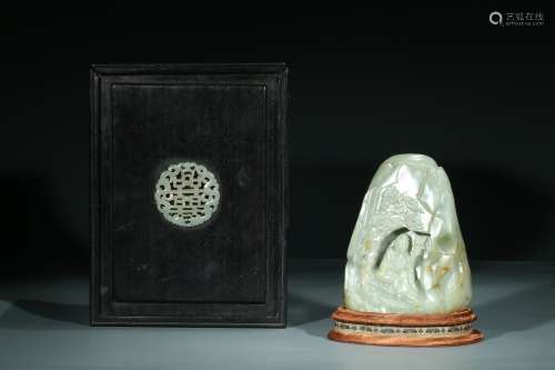 A CHINESE CELADON JADE CARVING OF MONK BOULDER
