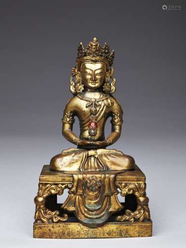 A GILT-BRONZE FIGURE OF AMITAYUS