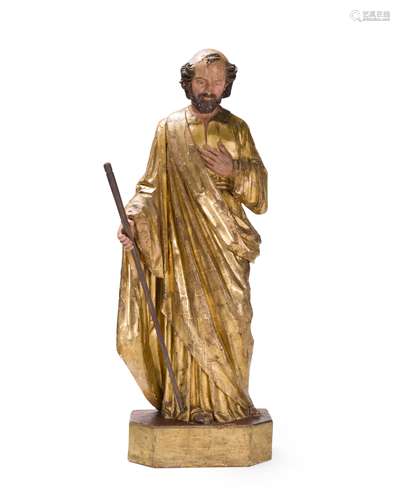 A carved and giltwood Santos figure