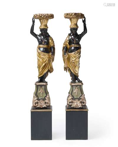 A pair of carved Venetian blackamore figures