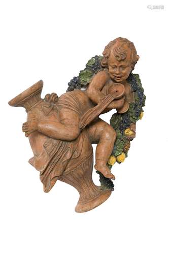 A partially-glazed Italian terra cotta putto