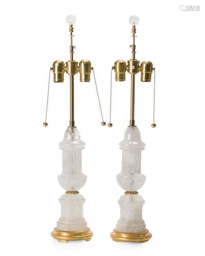 A pair of rock crystal, brass and giltwood table lamps