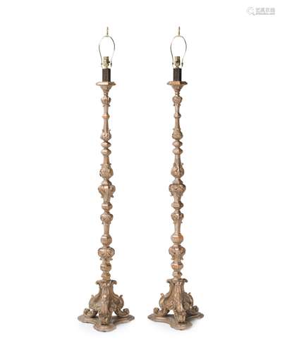 A pair of carved silvered wood torchieres