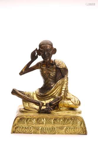 A SINO-TIBETAN GILT BRONZE FIGURE OF MILAREPA