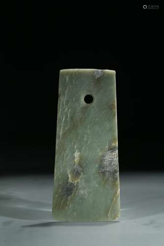 A GREEN JADE CARVED AXE BLADE