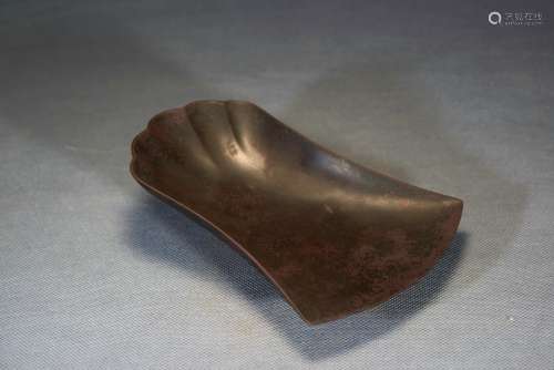 A CHINESE ROOF TILE SHAPED INKSTONE