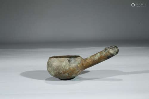 AN ARCHAIC BRONZE SPOON WITH ANCESTRAL HANDLE