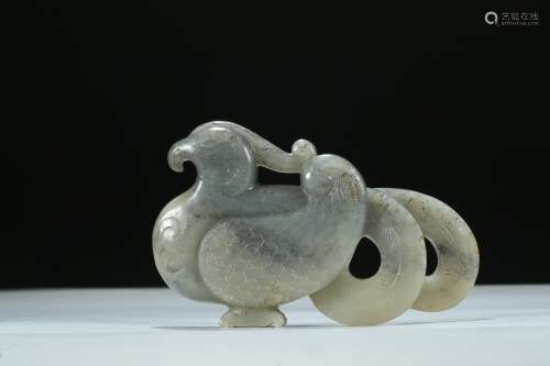 A CELADON JADE CARVED PHOENIX