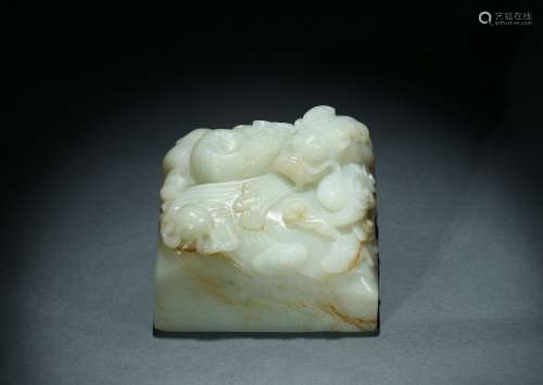 A WHITE JADE 'DRAGON' PAPER WEIGHT
