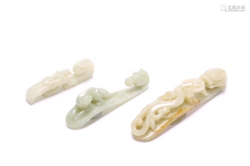 A SET OF THREE WHITE JADE BELT HOOKS