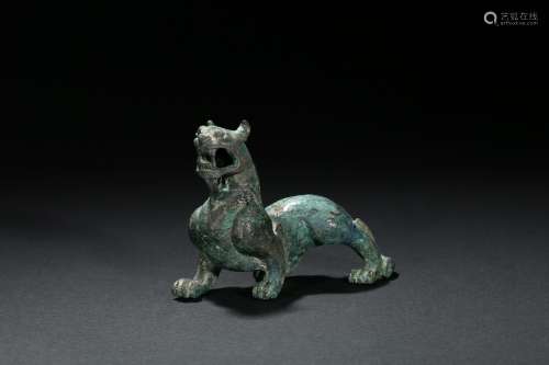 A PATINATED BRONZE FIGURE OF QILIN