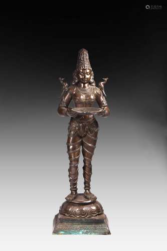 AN INDIAN STYLE BRONZE DEITY FIGURE