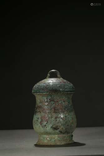 A CHINESE BRONZE 'TAOTIE' WINE VESSEL AND COVER