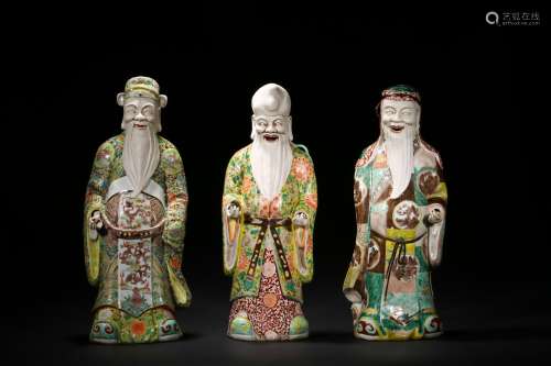 A SET OF THREE FAMILLE ROSE FU LU SHOU FIGURES