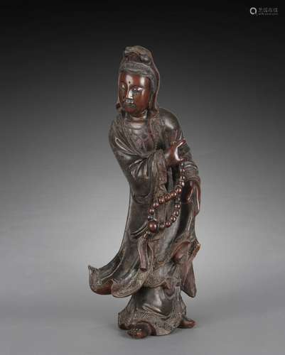 A CHINESE HARDWOOD GUANYIN CARVING