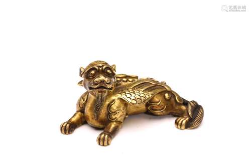 A CHINESE GILT BRONZE 'BUDDHIST LION' PAPER WEIGHT