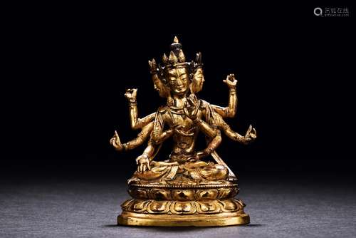 A GILT-BRONZE FIGURE OF USHNISHAVIJAYA