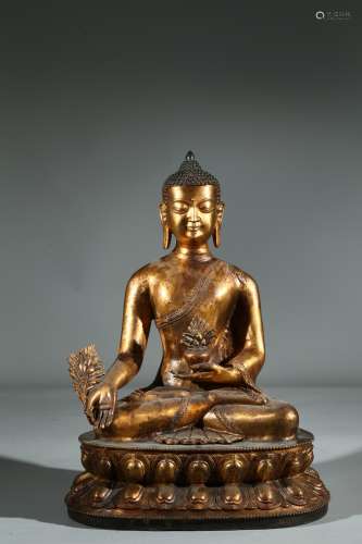 A GILT BRONZE FIGURE OF BHAISAJYAGURU