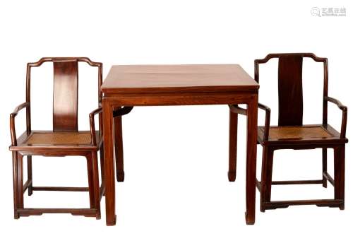 A CHINESE ELMWOOD TABLE AND TWO CHAIRS