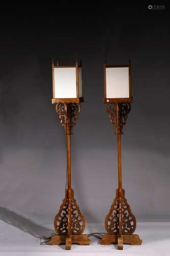 A PAIR OF YUMU CANDLE STANDS