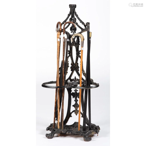 A Cast Iron Cane Stand with Canes