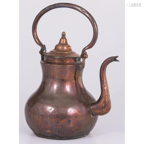 A Dutch Hammered Copper Kettle