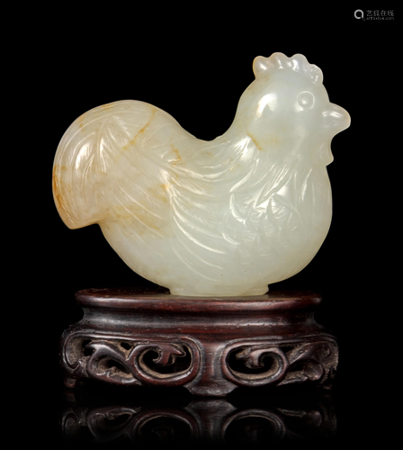 A Carved Pale Celadon and Russet Jade F…