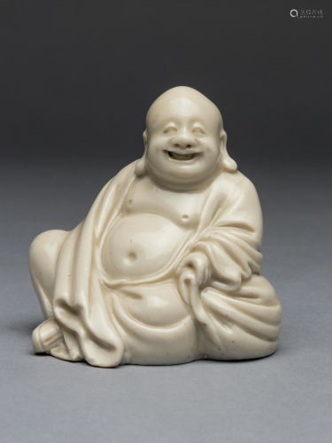 A Blanc-de-Chine Porcelain Figure of Budai …