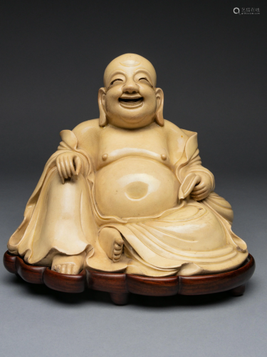 A White Glazed Figure of Budai Buddha H…