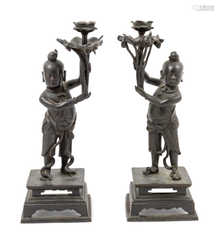 A Pair of Bronze 'Boy' Candle Holders Heig…