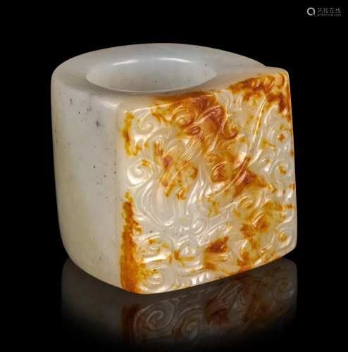 A Russet and White Jade Archer's Ring Diam in…