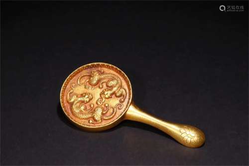 A Chinese Gilt Bronze Mirror Handle