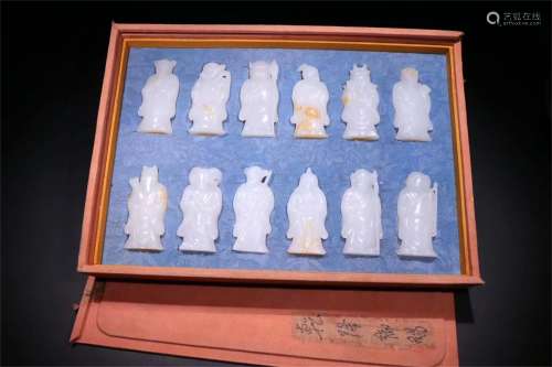 A Set of Twelve Different Chinese Carved Jade Belt Hooks