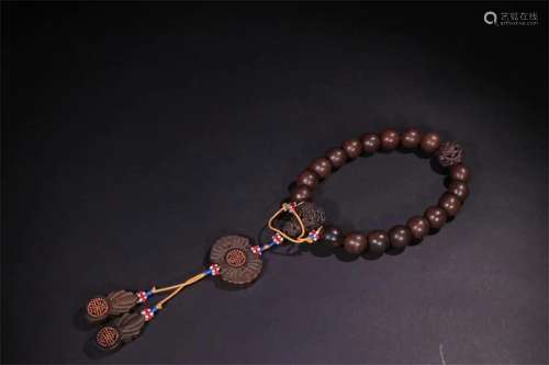 A Chinese Carved Agar-Wood Bracelet