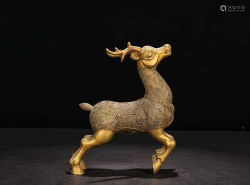 A GILT BRONZE DEER SHAPED ORNAMENT