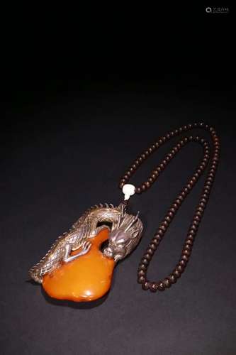 AN AMBER PENDANT