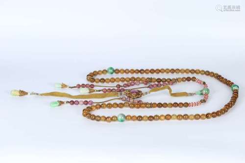 A QING DYNASTY YELLOW TOURMALINE ROSARY